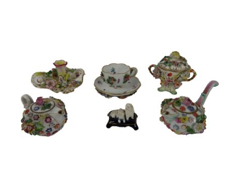 A small 19th Century Meissen Cup and Saucer, with encrusted flowers and painted with insects; a similar small Bowl and cover,