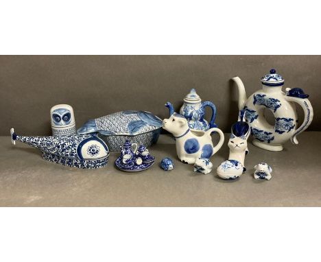 A selection of blue and white ceramics to include a miniature tea service and various jugs and tea pots 