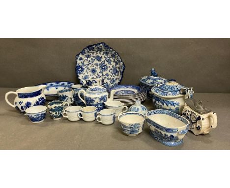 A selection of blue and white ceramics to include tea pots, dinner plates and a miniature tea service, various makers and age