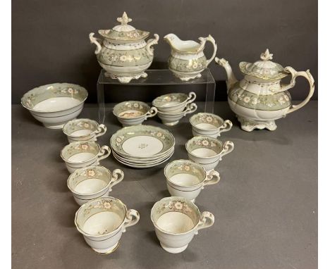 A Coalport Rococo style part tea set consisting of teapot, creamer, covered sugar bowl, slop bowl and cups and saucers 