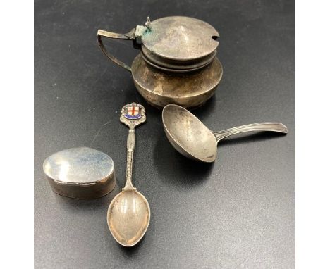 Four small silver items to include a caddy spoon, mustard pot, teaspoon and a pill box.