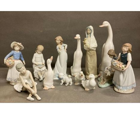 A selection of porcelain figurines to include Nao etc 