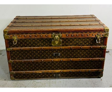 A monogram canvas Louis Vuitton steamer trunk with brass and oak mounts (H58cm W100cm D54cm) (No internal trays)