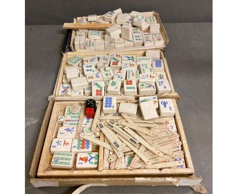 A quantity of1920's ceramic mahjong pieces made in England by Hickson along with some bone and some plastic betting sticks 