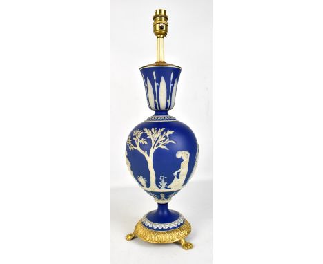 WEDGWOOD; a blue jasper dip relief decorated lamp with gilt metal mounted base and fitments, height including fitment 48.5cm.