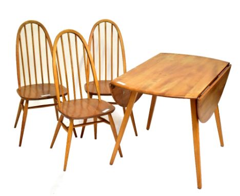 ERCOL; a light elm drop leaf dining table and three elm seated spindle back dining chairs (4).Additional InformationThere is 