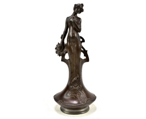 CHARLES KORSCHANN (1872-1943); an Art Nouveau figural posy vase, modelled in the form of a girl with flowing dress, raised ab