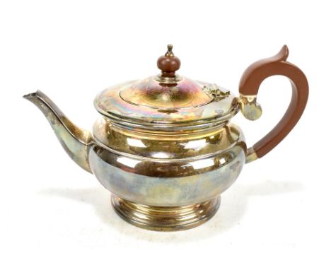 COOPER BROTHERS; a boxed Elizabeth II hallmarked silver teapot, stamped 'Regent' to base, length approx 26cm, Sheffield 1975,