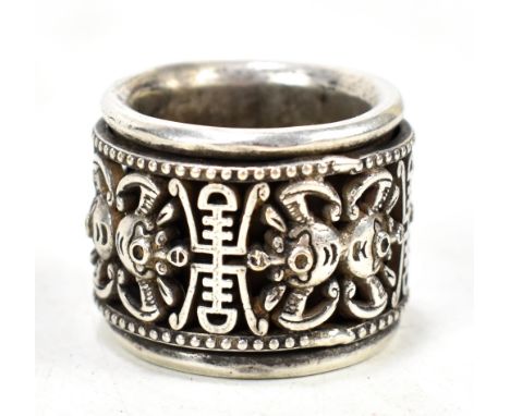 A Chinese silver archer's ring with rotating pierced band featuring stylised shou characters and bats, six character mark to 