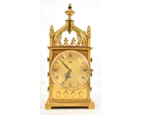 IMHOF; a Swiss gilt brass Gothic-style carriage clock, the circular dial set with Roman numerals and further inscribed 'Paris