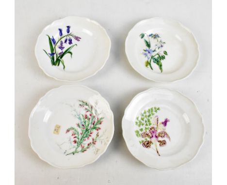 MEISSEN; a set of four early 20th century saucers, painted blue crossed swords mark to the reverse, diameter 15cm.Additional 