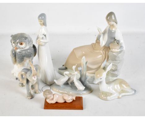 A mixed group of ceramic figures including Nao duck group, Lladro sleeping Christ, four similar animal figures. (7).