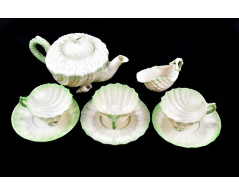 BELLEEK; a green Neptune part tea service, comprising teapot, milk jug, cups and saucers.Additional InformationTeapot with ch