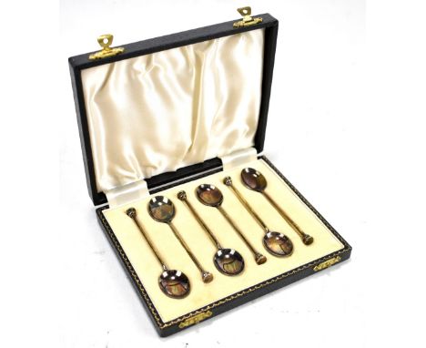 WILLIAM SUCKLING LTD; a cased set of six Elizabeth II hallmarked silver coffee spoons, the bowls enamelled to the reverse wit