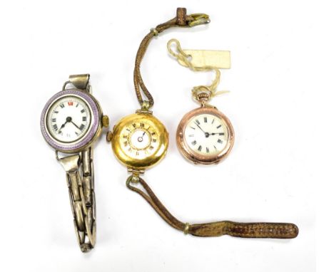 An 18ct yellow gold cased half hunter wristwatch (af), a yellow metal open face lady's wristwatch and a white metal and ename