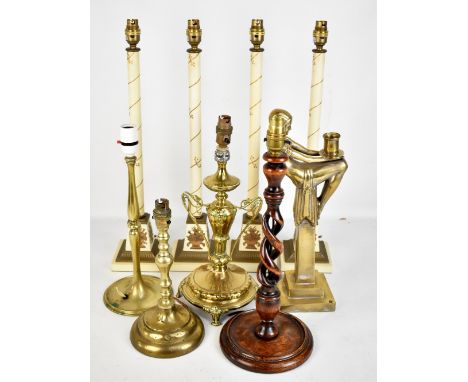 W.M.F; an Art Nouveau twin handled brass lamp, height 40cm, a reproduction Art Deco style candle holder and seven assorted la