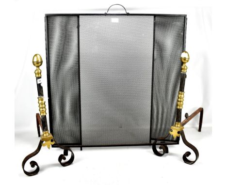 A pair of steel and brass andirons, height 62cm, and a large articulated firescreen (3).