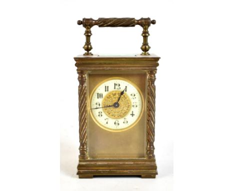A late 19th century French brass carriage clock, the circular dial set with Arabic numerals, height 14cm.