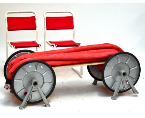 A unique bench made from a fireman's hose and wheel, length 142cm, a green garden bench, length 122cm and four metal framed g
