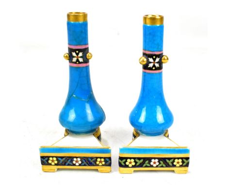 DR CHRISTOPHER DRESSER FOR MINTON; a pair of menu holders modelled as a baluster form vase with relief and enamelled decorati