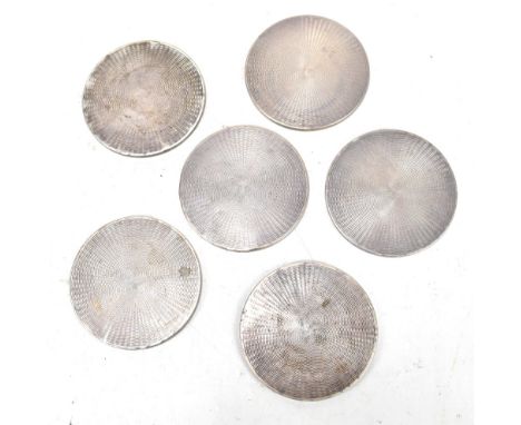 BROADWAY &amp; CO; a set of six Elizabeth II hallmarked silver mounted coasters with engine turned detail, Birmingham 1978, d