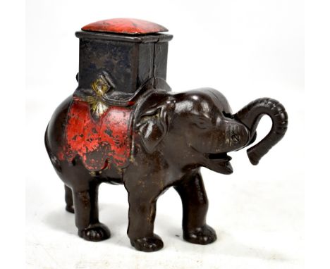 A 19th century cast iron money box modelled as an elephant and driver with sprung lid and trunk, box 15 x 17cm.