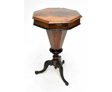 A Victorian burr walnut octagonal topped sewing cabinet, the hinged cover enclosing fitted compartments with assorted sewing 