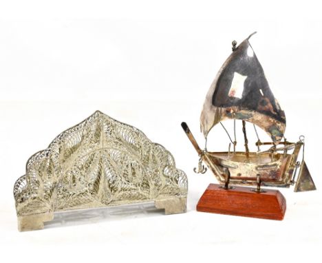 A circa 1900 Chinese white metal model junk (with stand and cased), unmarked, 13 x 11.5cm, and a filigree work letter rack, l