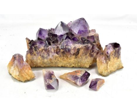 A natural amethyst rock crystal, length 28.5cm (af).
