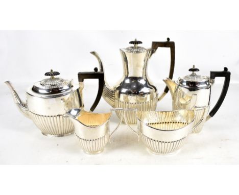 JOHN HENRY POTTER; a George V hallmarked silver three piece coffee set with gadrooned detail, comprising teapot, twin handled