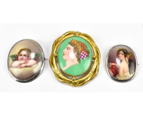 Three hand painted ceramic brooches of oval form, including a yellow metal framed example with a portrait bust of a lady wear