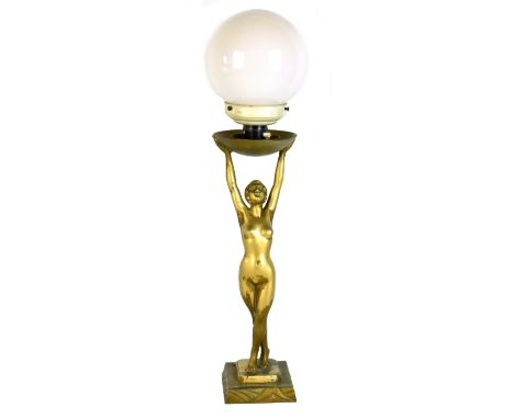 LIMOUSIN; an Art Deco bronzed spelter figural table lamp depicting a nude female supporting a glass shade, impressed signatur