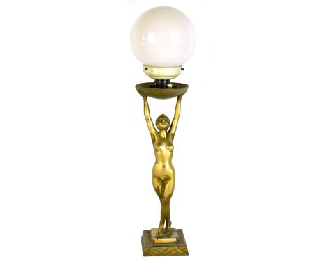 LIMOUSIN; an Art Deco bronzed spelter figural table lamp depicting a nude female supporting a glass shade, impressed signatur