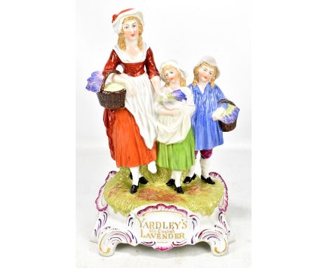 A Yardley's 'Old English Lavender' advertising ceramic figure group, impressed Dresden mark to underside, height 30.8cm.