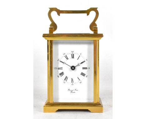 BORNAND FRERES OF BICESTER; an early 20th century brass cased carriage clock, the circular enamelled dial set with Roman and 