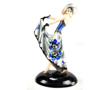 STEFAN DAKON FOR GOLDSCHEIDER; an Art Deco flapper figure in floral motif dress on convex oval base with printed marks, no. 6