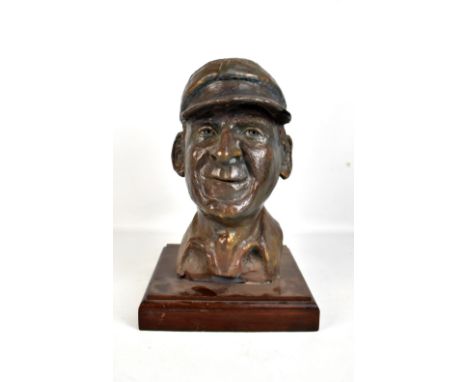 A bronzed ceramic bust depicting Sir Francis Chichester, raised on mahogany plinth base, height 39cm.