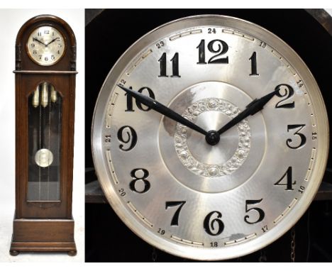 An early 20th century oak cased three weight longcase clock, the silver planished dial set with Arabic numerals, height 203cm