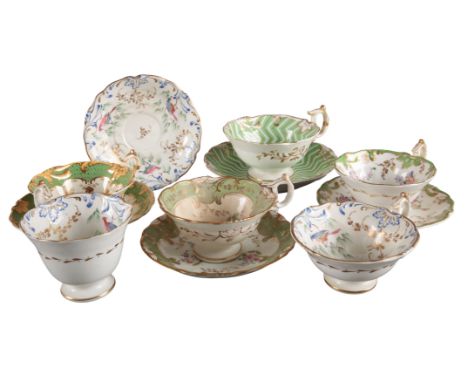 A GROUP OF FIVE H & R DANIEL FIRST BELL SHAPE CUPS AND SAUCERS including a trio decorated with exotic birds, a large teacup i