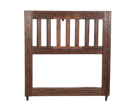 AN OAK PLATE RACK OR WALL SHELF 17th century or later, with three grooves for plates, naively embellished with carved 'egg an