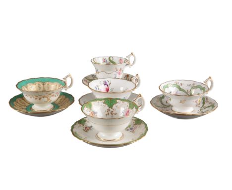 A GROUP OF FIVE H & R DANIEL SECOND BELL SHAPE CUPS AND SAUCERS including four teacups, in pattern 7083, pattern 6676, patter