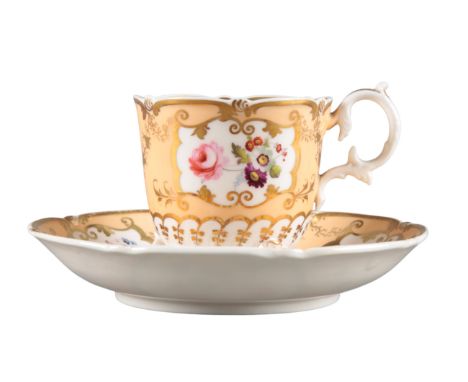 AN H & R DANIEL C-SCROLL CUP AND SAUCER pattern number 4368, the apricot ground decorated with panels of flowers, the cup wit