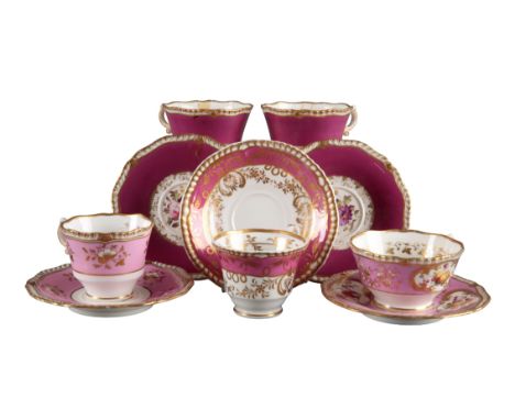 A GROUP OF FOUR H & R DANIEL FIRST GADROON SHAPE CUPS AND SAUCERS including a pair of teacups with maroon ground and decorate