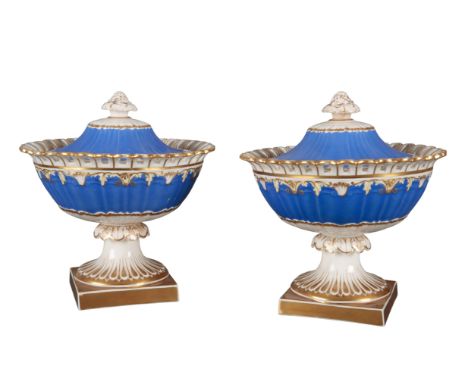 A PAIR OF H & R DANIEL RIBBED 'A' SHAPE CREAM BOWLS decorated in pattern 4801, with blue borders and gilt acanthus leaf edgin