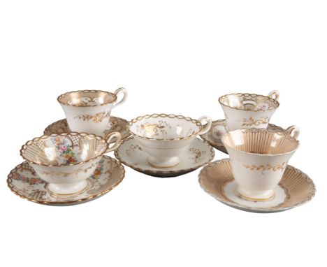 A GROUP OF FIVE H & R DANIEL CHAIN EDGE SHAPE CUPS AND SAUCERS including three coffee cups, in pattern 7131, pattern 7005, an