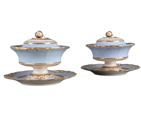A PAIR OF H & R DANIEL SECOND GADROON SHAPE CREAM BOWLS AND STANDS the sky blue border and gilt banding, painted with landsca