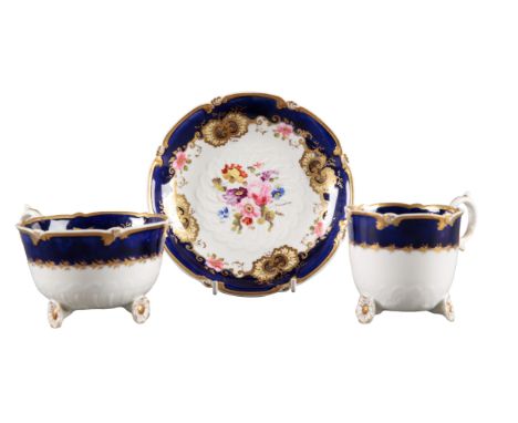 AN H & R DANIEL C-SCROLL TRIO pattern number 4415, with blue and gilt banded borders and spray of flowers to the centre, the 