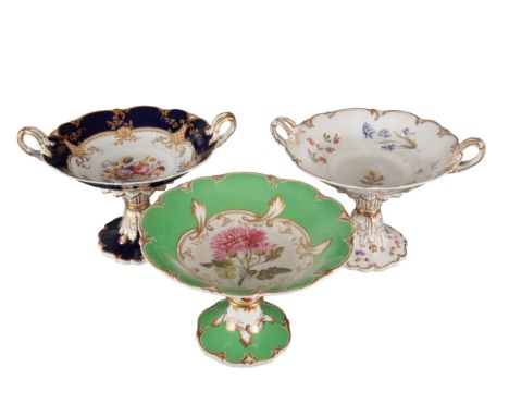 A GROUP OF THREE H & R DANIEL ROCOCO SCROLL SHAPE CENTREPIECES including one in pattern 6130, with green borders and gilt ban