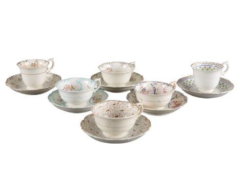 A GROUP OF SIX H & R DANIEL SHELL 'B' SHAPE CUPS AND SAUCERS including tea cups in pattern 4989, pattern 1980, pattern 5074 a