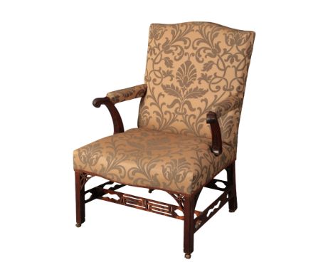 A GEORGE III MAHOGANY GAINSBOROUGH ARMCHAIR 18th century and later, with serpentine padded back, downswept scrolled reeded ar